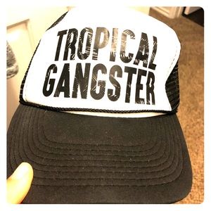 Black and white tropical gangster trucker hat.